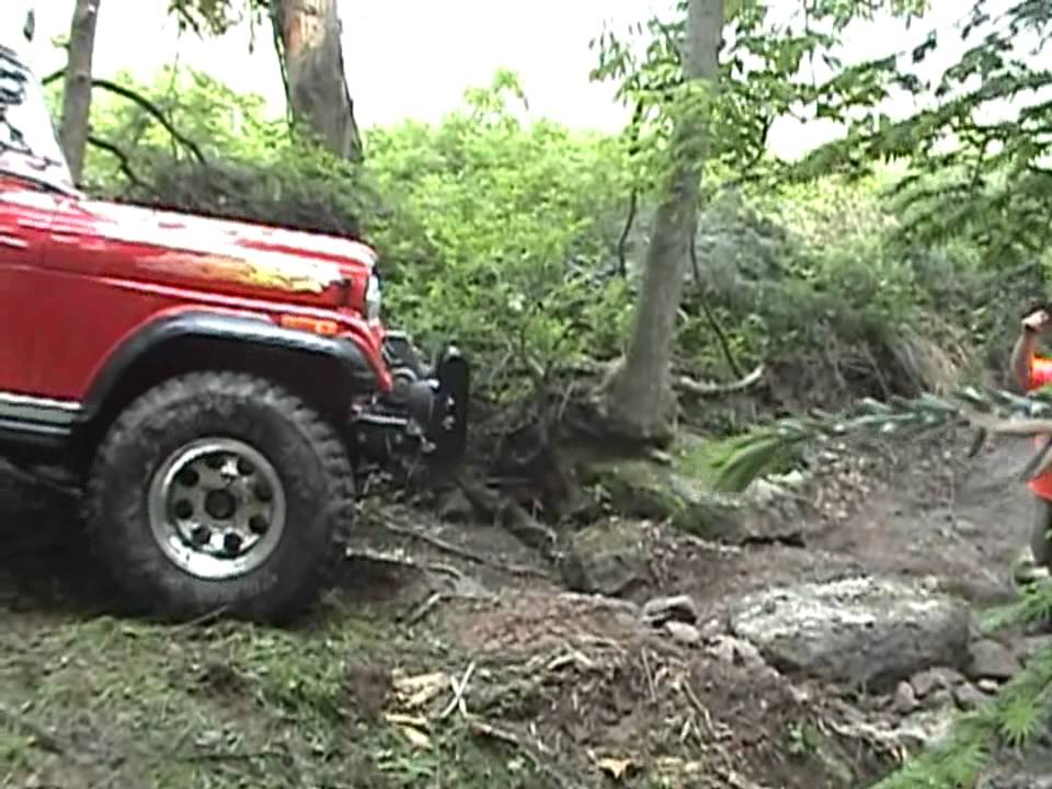 Jeep CJ off roading Going down a dry stream bed in the Poconos in Pa