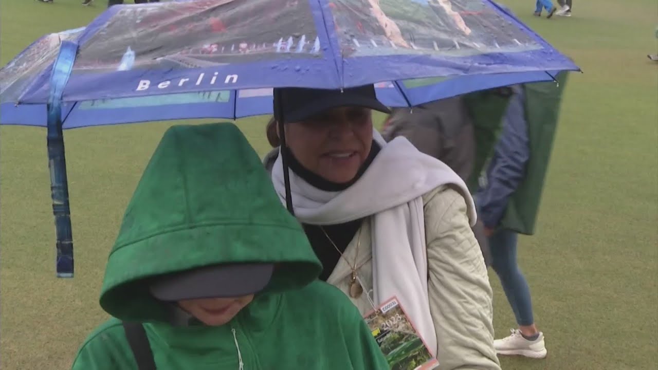 Masters patrons in rain