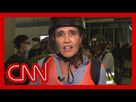 CNN reporter describes 'chaos' as riot police charge protesters