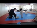 Cute little boy trying to break board in taekwondo