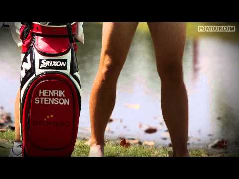 Henrik Stenson strips to hit shot from the water!