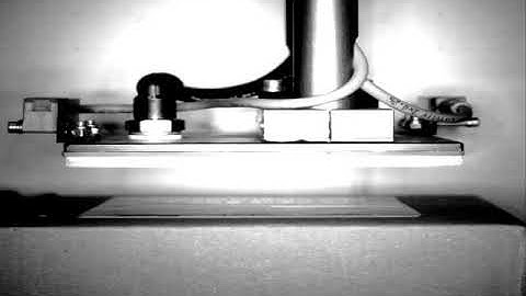 Tamp Blow Labelling Process in Slow Motion