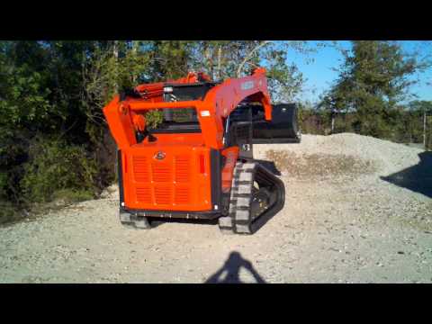 Kubota SVL90 loading dump truck