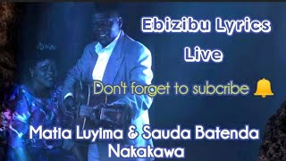 Ebizibu/emmotoka enkadde Lyrics - Matia Luyima and Sauda Batenda Nakakawa #mwamibugembe #kadongokamu