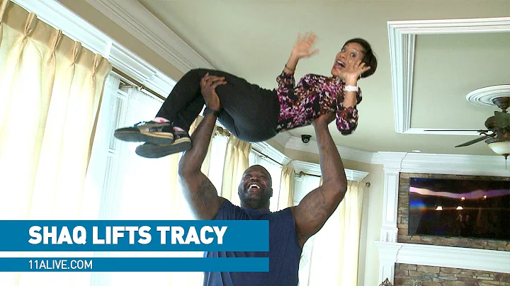 Shaq lifts Tracy Humphries in his Atlanta home