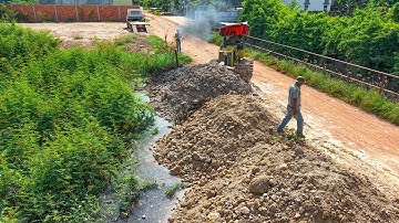 Start New Project Landfill clearing Flooded land by Expert driver dozer pushing with dump truck