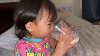 TOODLER DRINKING MILK in a glass