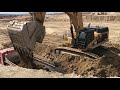 Cat 365C Excavator Loading Trucks With Three Passes