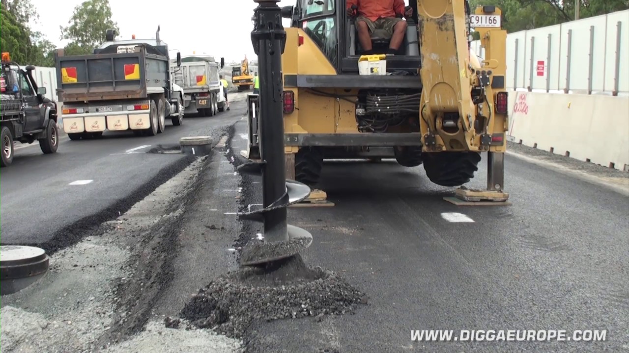 Backhoe with Digga Rock Auger