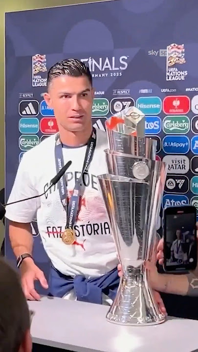Bruno Fernandes brings the trophy to Cristiano Ronaldo during his interview!