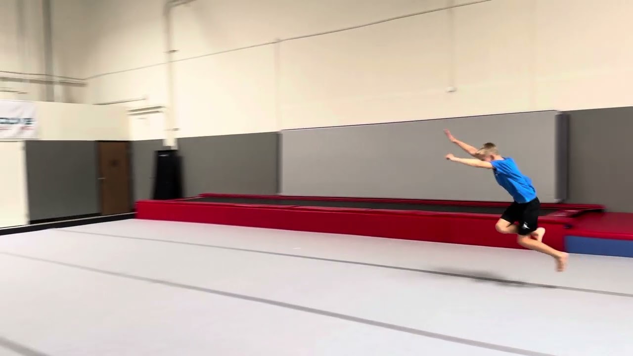 One handed round off back tuck