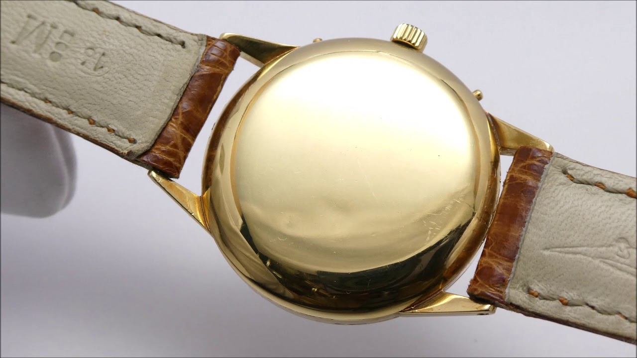 Movado 18k gold vintage triple date calendar