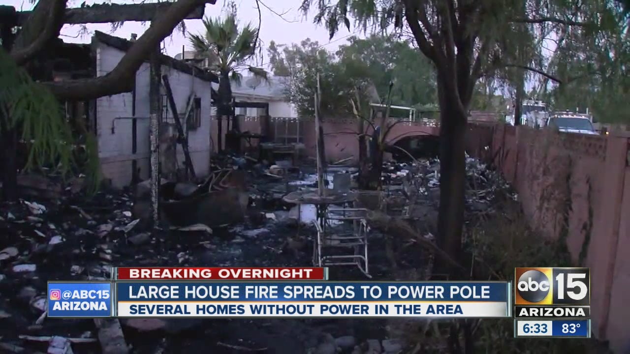 Four people displaced after house fire spreads to power pole - YouTube