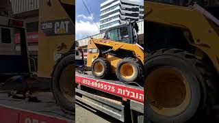 tow truck / bobcat / caterpillar