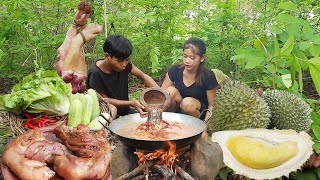 Durian fruit and pig legs for food in forest - Pork legs spicy cooking for lunch, Survival cooking