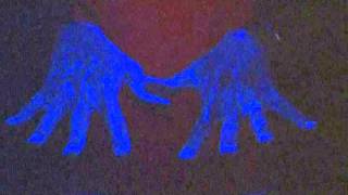 Handwashing under a black light