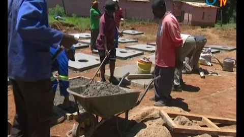 Constructing PIT latrines  for 60 households