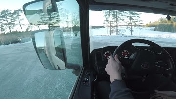 Reversing into loading dock with Scania G450 and trailer