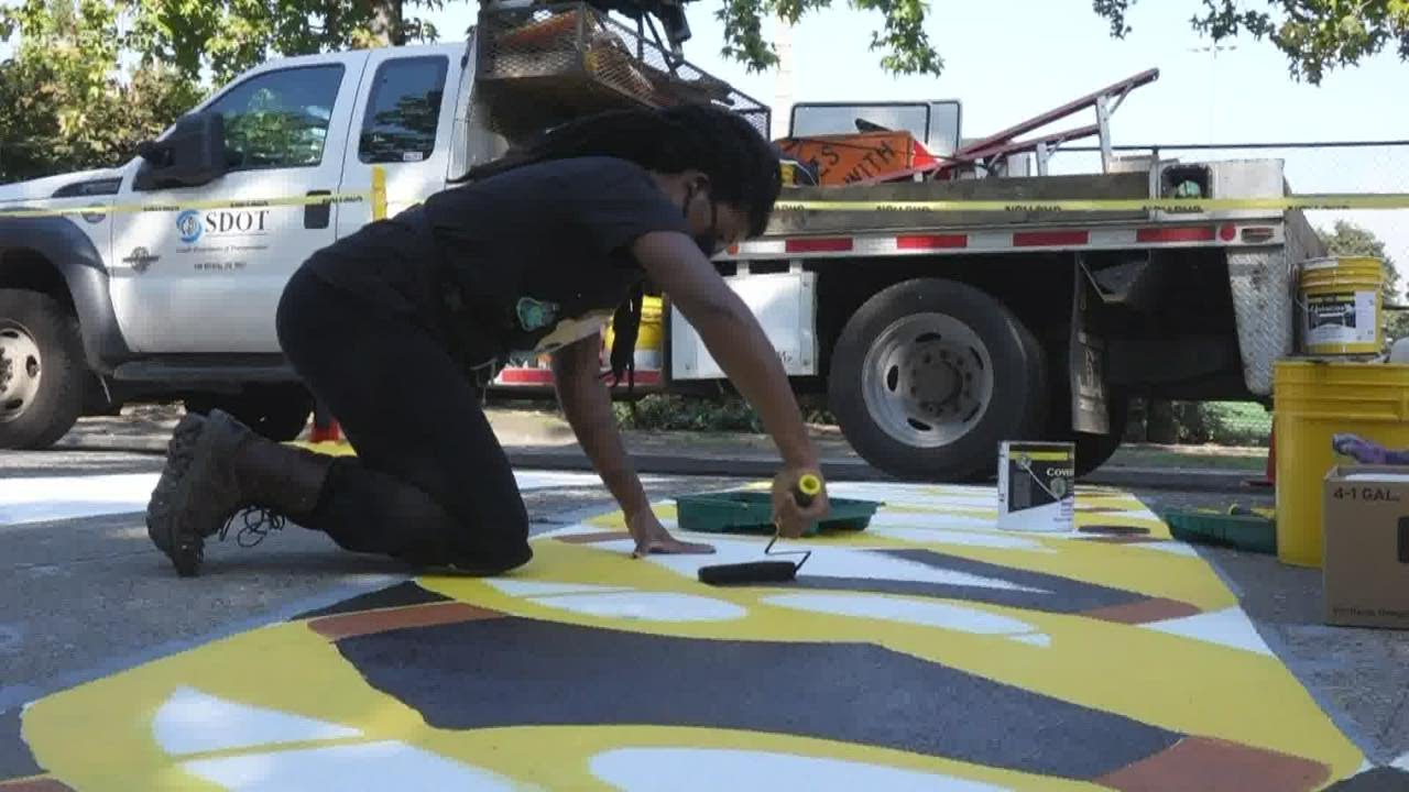 Seattle artists restore Black Lives Matter street mural on Capitol Hill with help from city