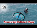Wing recovery derek hama recovers two popped wings during a wing foiling session on the north shore