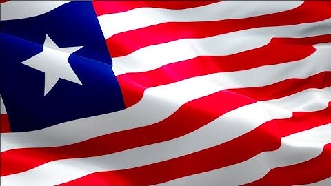 Liberian flag video waving in wind. Realistic Monrovia Flag background. Liberia flag Full HD
