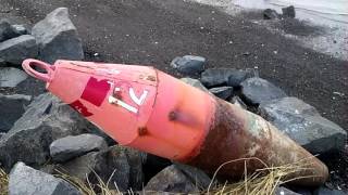 A Look At A United States Coast Guard Buoy Which Washed Up On Shore In The Bronx