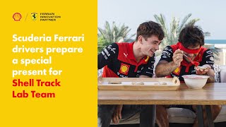 Watch Charles Leclerc &amp; Carlos Sainz Prepare Gingerbreads for the Shell Track Lab Team