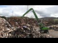 SENNEBOGEN - Scrap Handling: 830 Mobile Material Handler loading scrap into shredder at SIMS, UK