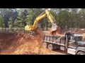 John Deere 200C LC Loading a Tandem Dump Truck