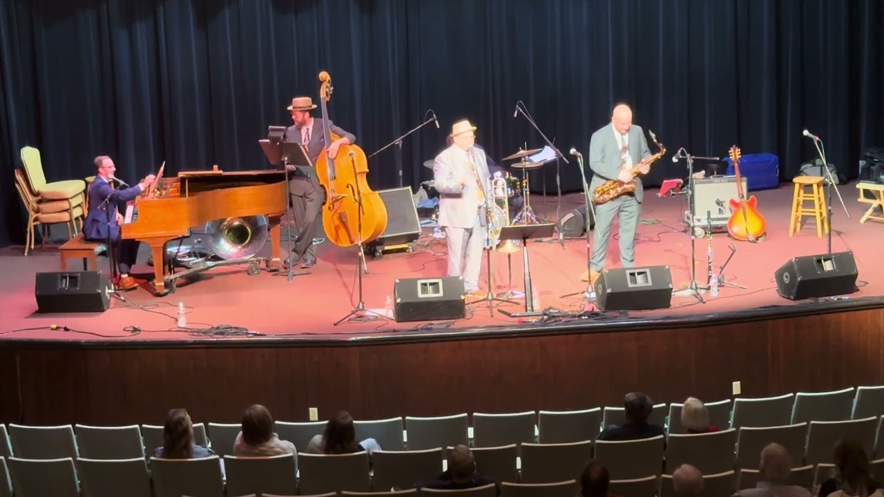 Guitarist playing live music on stage with his band