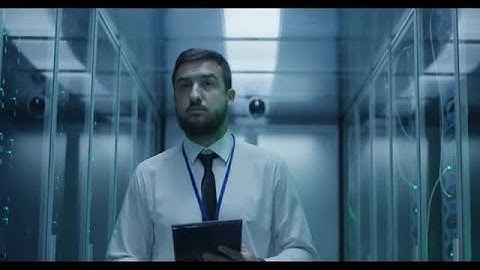 Engineer Walking In Server Room Stock Video