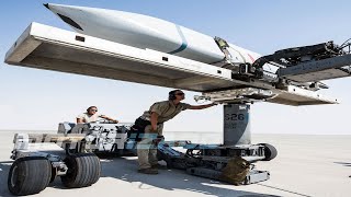 US Air Force Weapons Loaders Arm B-52H Stratofortress Aircraft