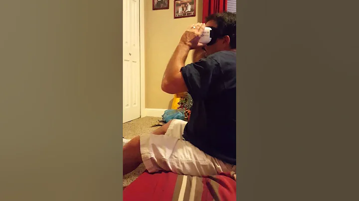 Danny Burdette  playing a virtual reality game, to