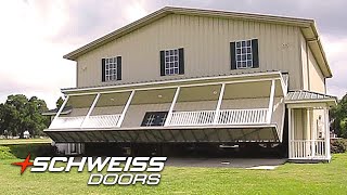 Hangar Home Porch with a Unique Schweiss Hydraulic Garage Door Hidden