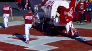 Oklahoma Sooners flag carrier falls out of wagon and still waves flag