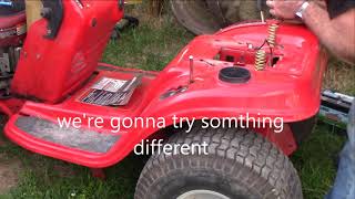 taking apart a TroyBilt riding mower to fix a cracked frame