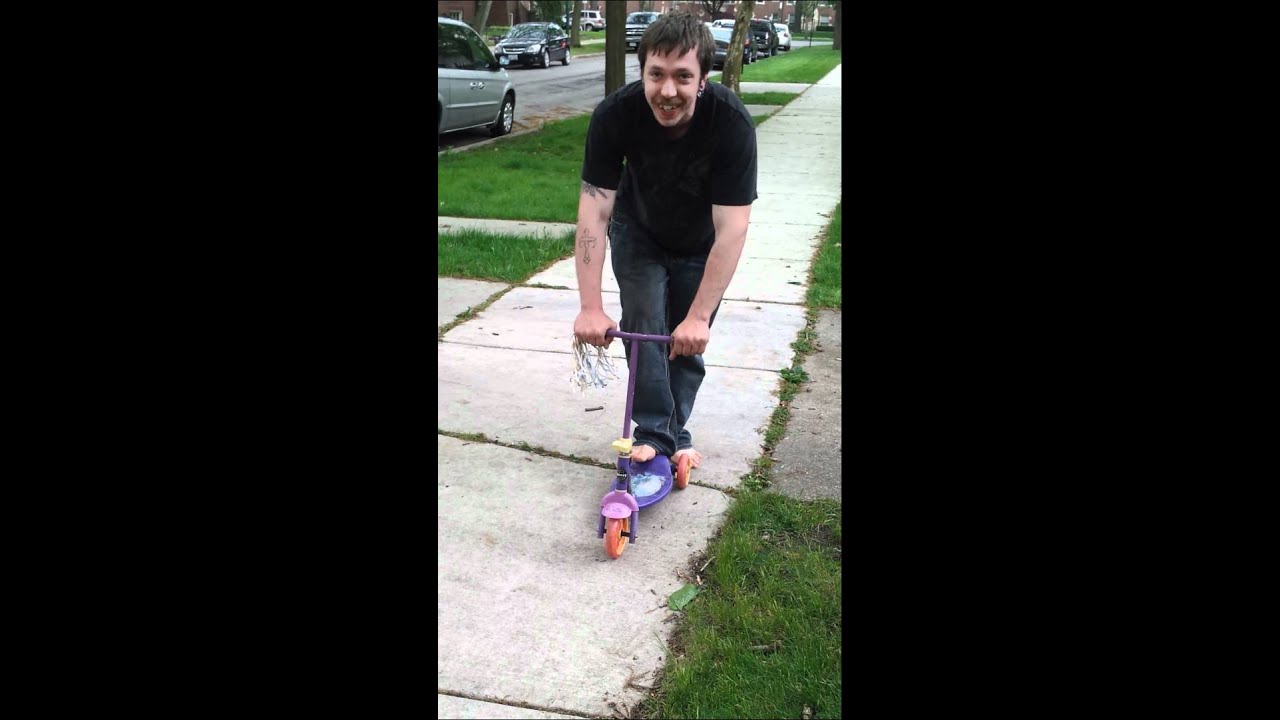 John rides a scooter YouTube