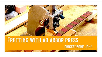 Installing frets using an arbor press