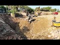 Expertly executed canal foundation construction in extreme place excavator bulldozer truck