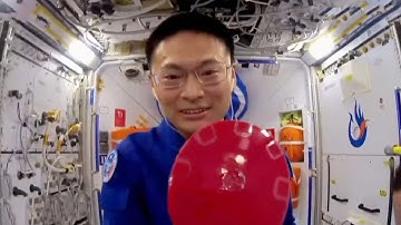 In-orbit Chinese astronauts carry out table tennis ball experiment