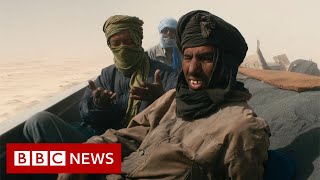 Fleeing the shifting sands of the Sahara desert, due to climate change - BBC News