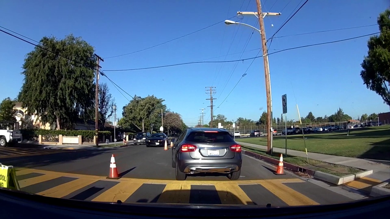 North American High school student close call crossing the street