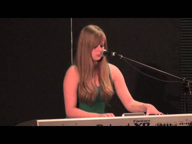 Ashleigh Brett  on Piano  SingOut singing and performance school