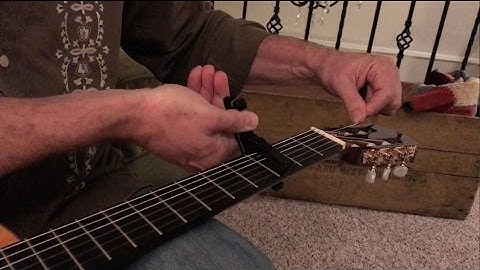 String changing hack - using a capo to make string changes easier on guitar, mandolin, etc.