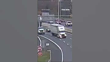 HIGHWAY HAZARD: A dump truck with its bed raised slams into two overhead signs #shorts #foxnews #fox