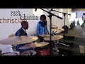 Christian rush is playing lingala rumba on Drums