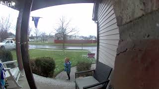 Little girl slips and falls down icy stairs in front of house (Security camera)