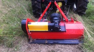 Mowing my field with a flail mower towed behind the tractor