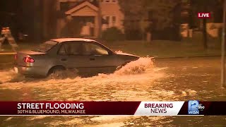 Cars spotted driving over flooded streets on Bluemound Road screenshot 4