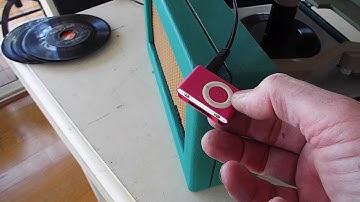 RCA 45 record player with iPod input jack playing an iPod adapter.